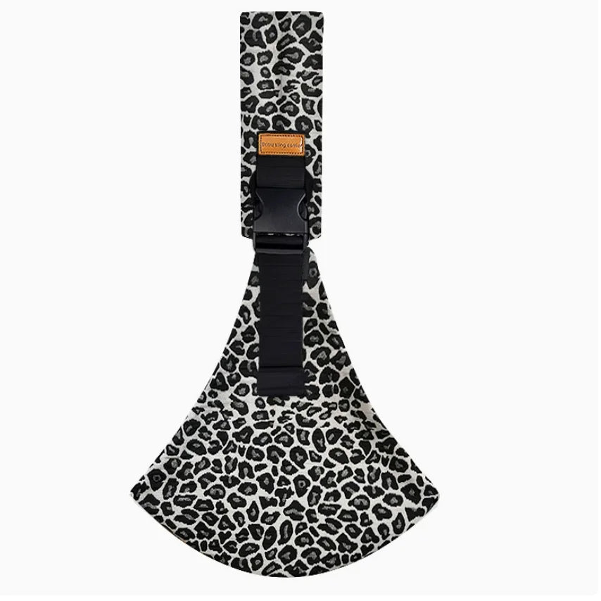 Leopard print multifunctional infant carrying bag with black straps on a white background