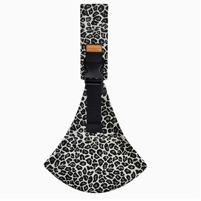 Leopard print multifunctional infant carrying bag with black straps on a white background